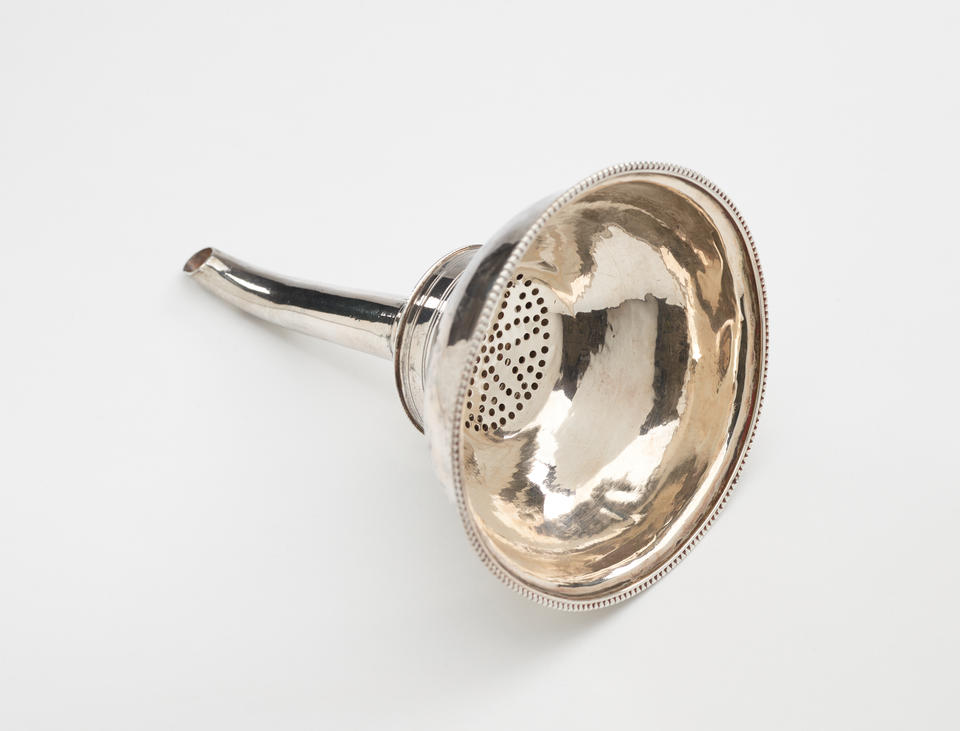  A simple silver wine funnel that goes from large to a very skinny section.