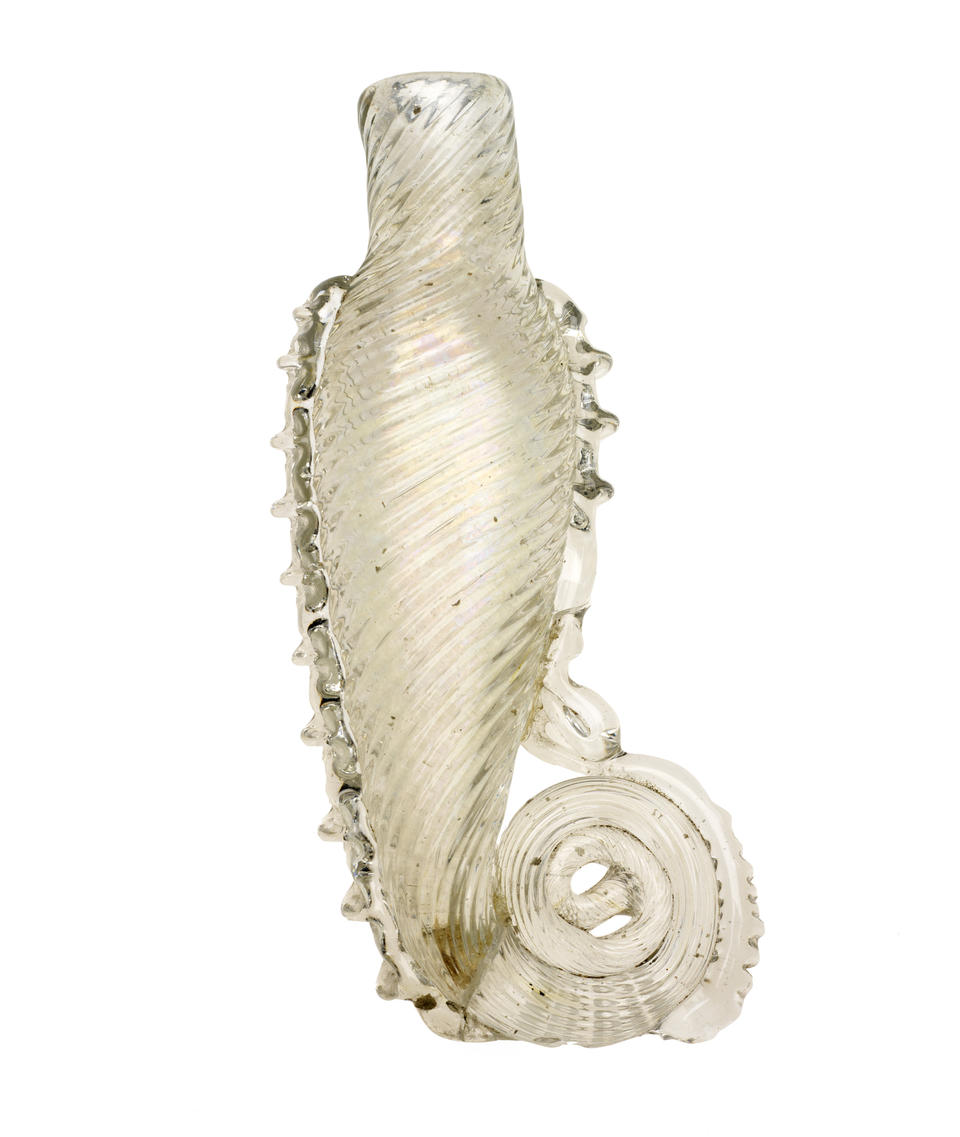 A glass teardrop vial with spiral scoring. The bottom of the vial curls into a spiraling tail.