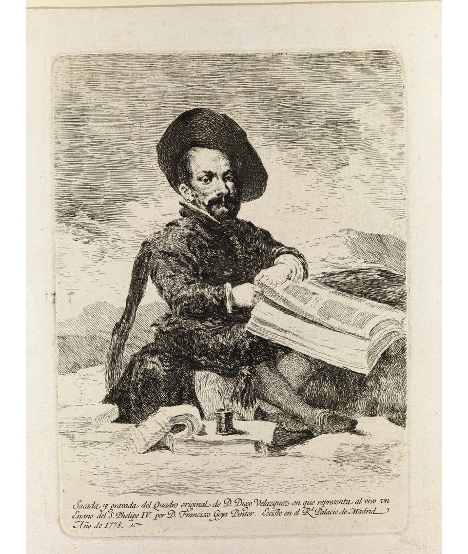 In an etching on beige paper, a little person sits cross-legged among books, papers, and a pot of ink. He wears an 18th-century suit and wide-brimmed hat. Text at the bottom is in Spanish. Translated into English reads: “Taken and captured from the original painting of Diego Velazquez which represents the Dwarf of King Philip IV by Francisco Goya, [illegible] in the Royal Palace of Madrid, 1773.”