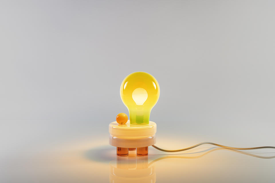 A modern night lamp with hand blown parts and tricycle solid glass foot 