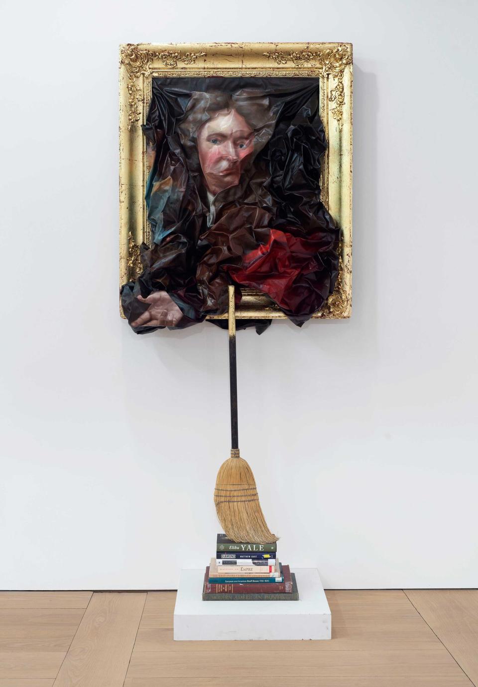 Titus Kaphar's work Unfit Frame features a wrinkled and disfigured canvas of Elihu Yale of Yale University, whereas below the painting is a stack of books which emphasize Yale's history and fortune. The books prop up a straw broom which leans against the frame of the canvas above. 