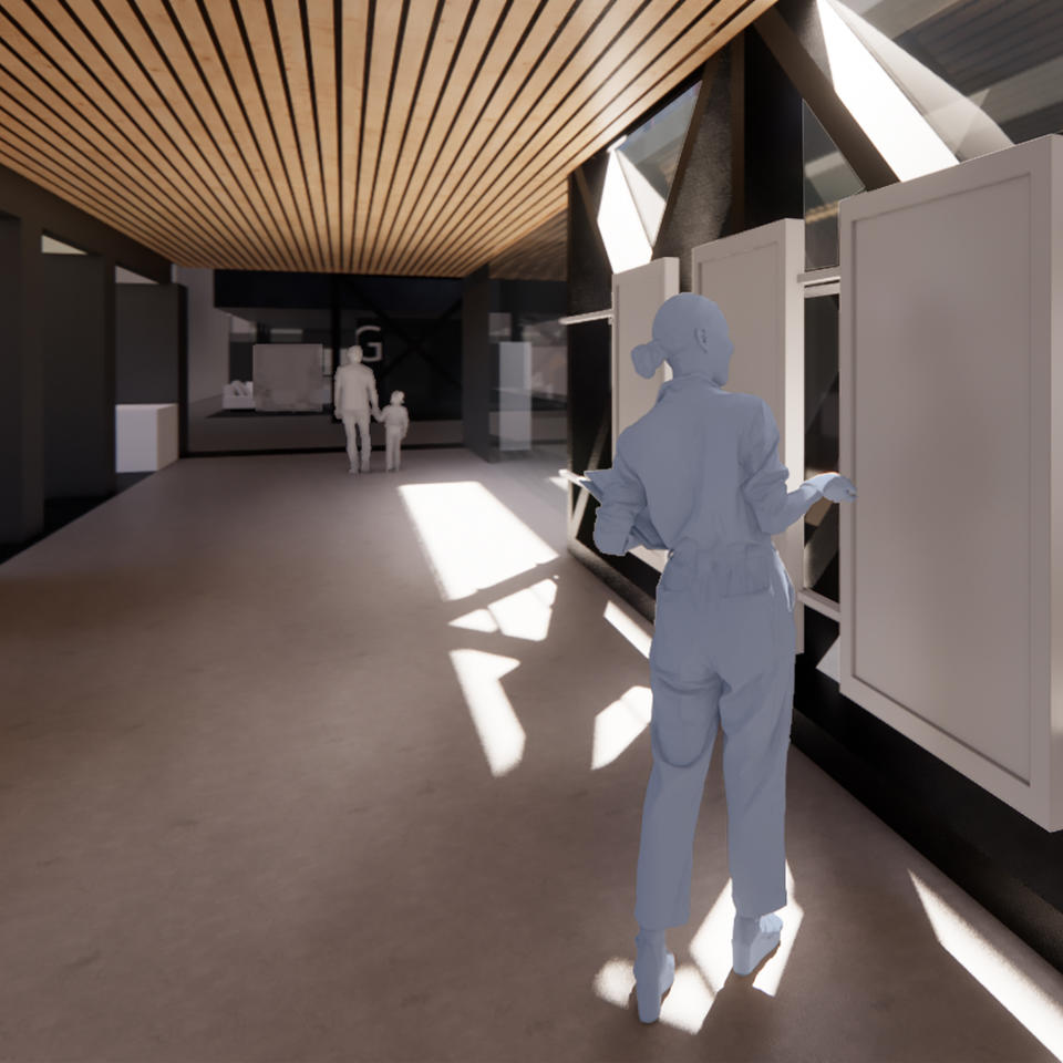 A rendering shows a woman standing in a brightly lit corridor in from of information screens; a man and child are walking at the end of the corridor.