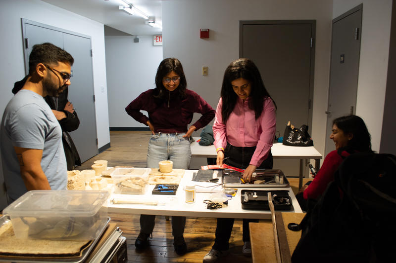 A group of participants selecting designed mycelium materials and tools for prototyping 