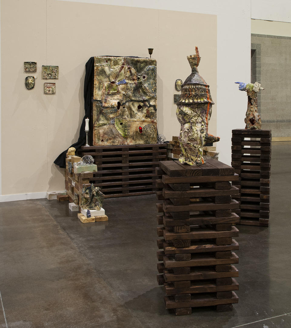 installation of big porcelain box with multiple ceramic objects to the sides