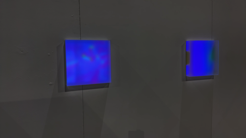 Photo documentation of installation featuring a close-up of two of the three light boxes.