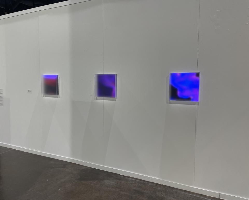 Photo documentation of installation featuring a close-up of the three light boxes.