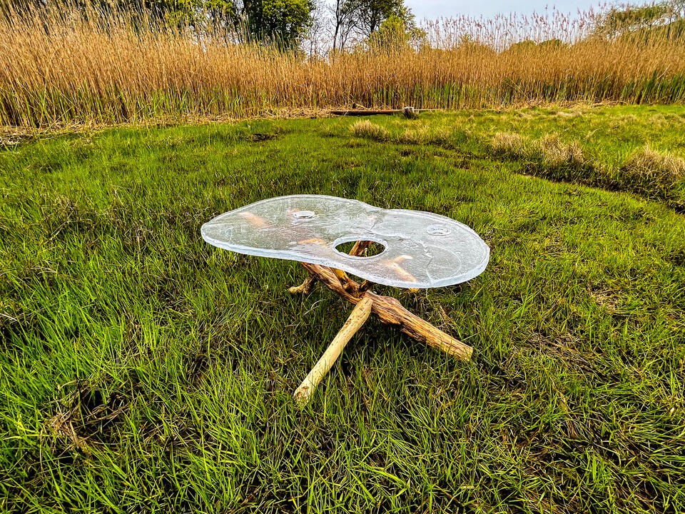 Ritual table positioned at the transition zone of the marsh on the RISD farm. It is made from hotcasted glass and driftwood.