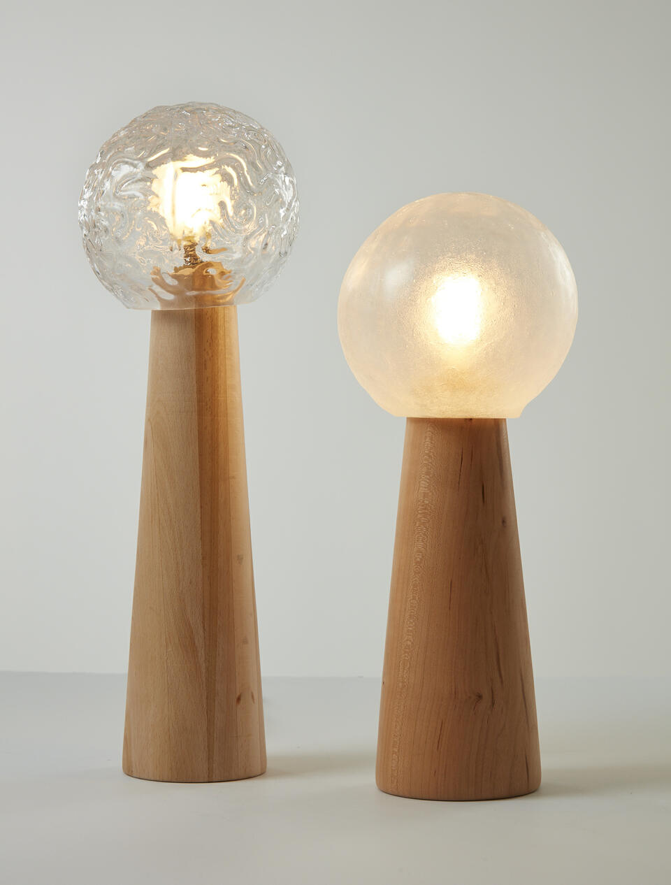 Table Lamps made of glassblown glass, beech, cherry and lightbulb.
