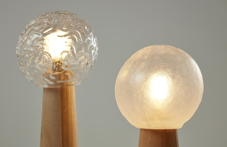 Detail of Table Lamps made of glassblown glass, beech, cherry and lightbulb.