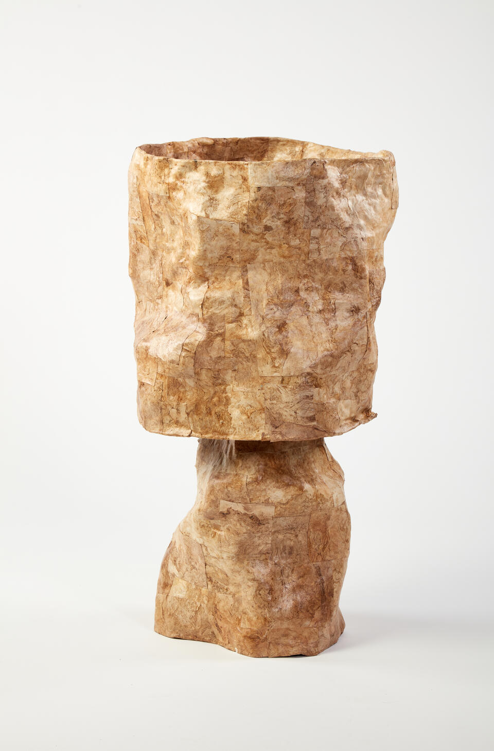 This golden hued lamp is made of paper with vivd swirls of naural fibers that move in all directions. The paper is cut into squares and collaged on the lamp shade and base in assorted sizes.