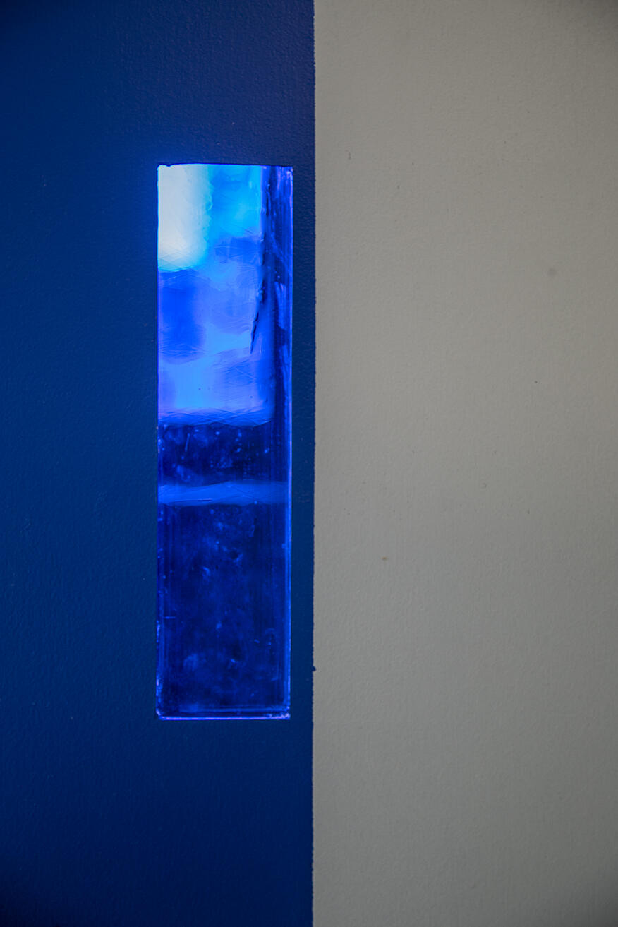 Blue stained glass integrated into fabricated wall acts as a filter to my memory realm, unraveling blue carpet memories.