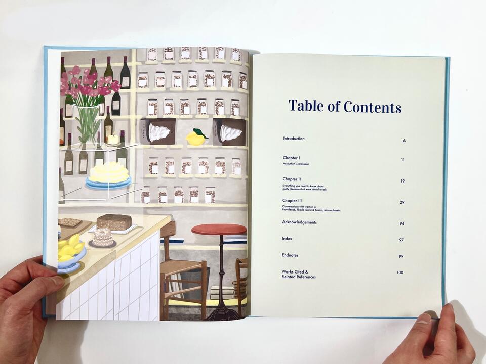 A photograph of the spread of "Table of Contents" featuring illustration on the left side and text on the right page.