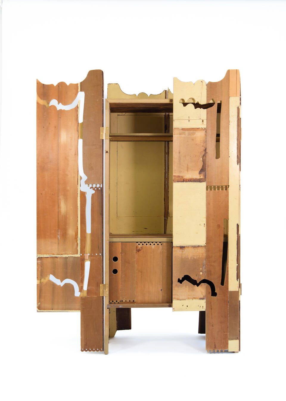 A Cabinet made from the deconstructed materials of a found dresser in warm yellow. 