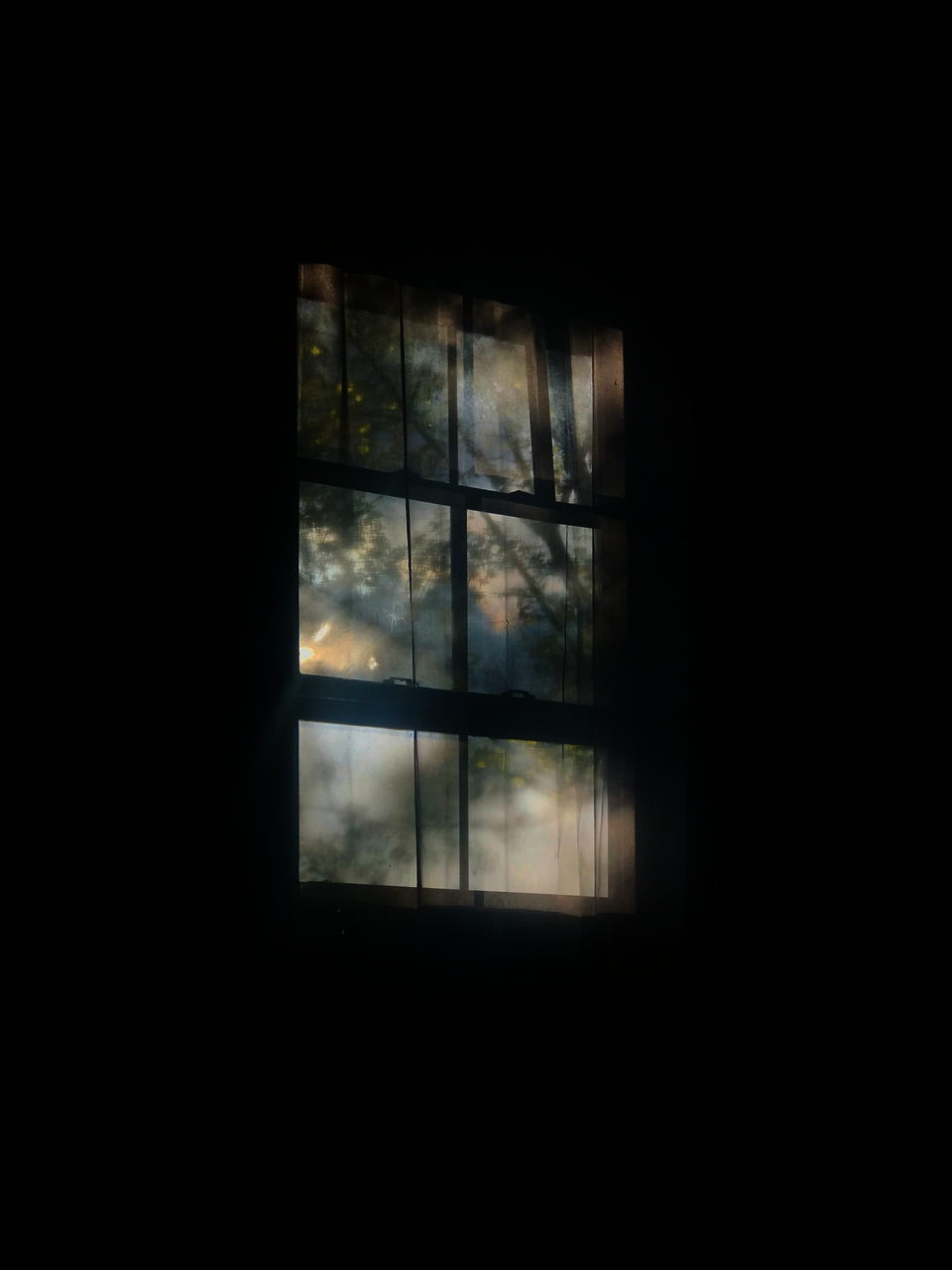 Woven representation of a window with light passing through a metallic surface, framed and bordered by wood trim textile.