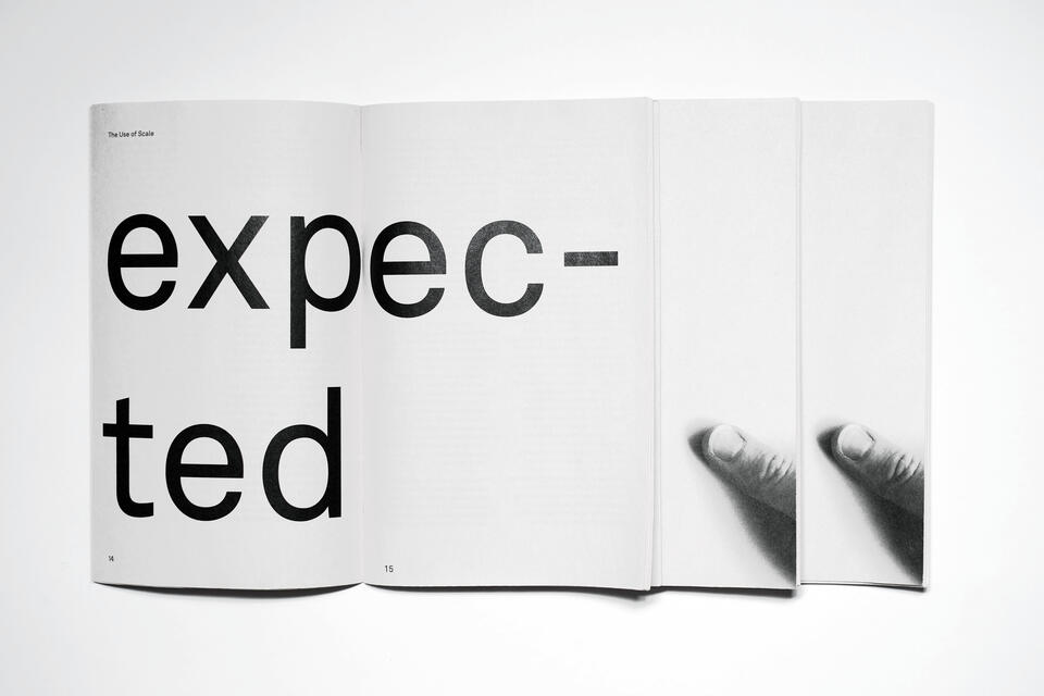 Three books laid out. One is open, reads 'expected'. The other two feature a photo of a thumb holding the book.