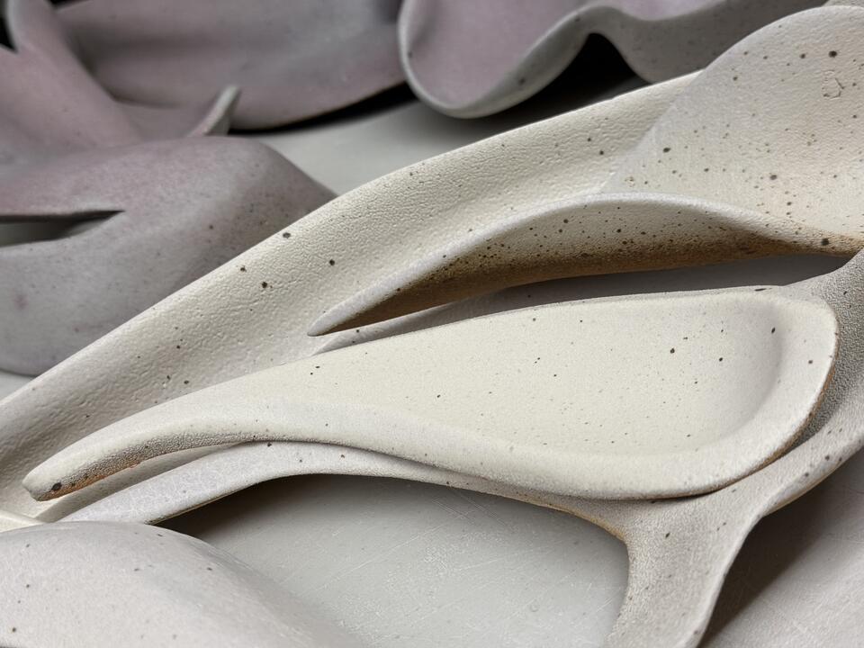 Detailed view of a ceramic sculpture with textured surface