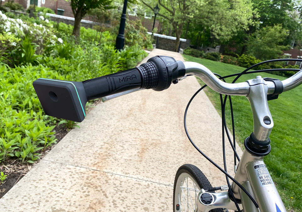MIRA, a machine vision haptic handlebar grip mounted on a bicycle.