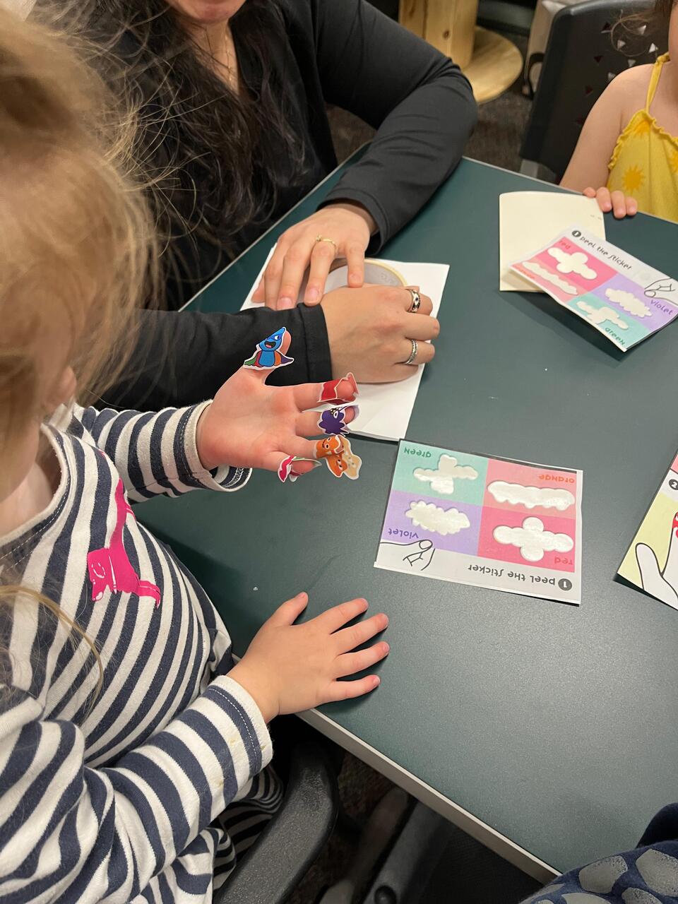 Children playing with the Sip Jab Zoop stickers. Designed to reduce the fear of needles and turn into a fun experience.