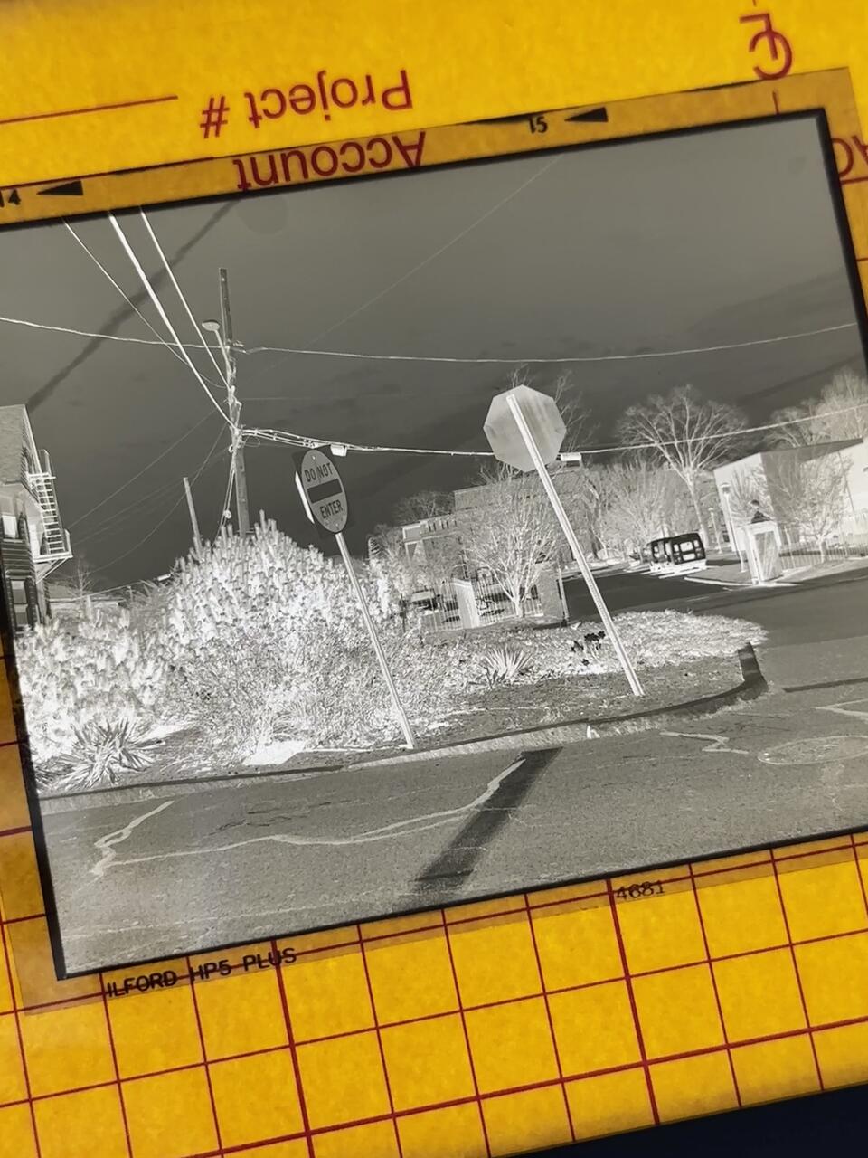 The negative of my print, taken in the middle of Hope St, showing my process: shooting, walking, developing, printing.