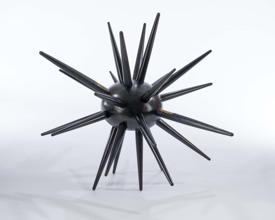 Urchin is a spiked ash wood cabinet with hidden drawers, symbolizing self-protection and inner vulnerability.